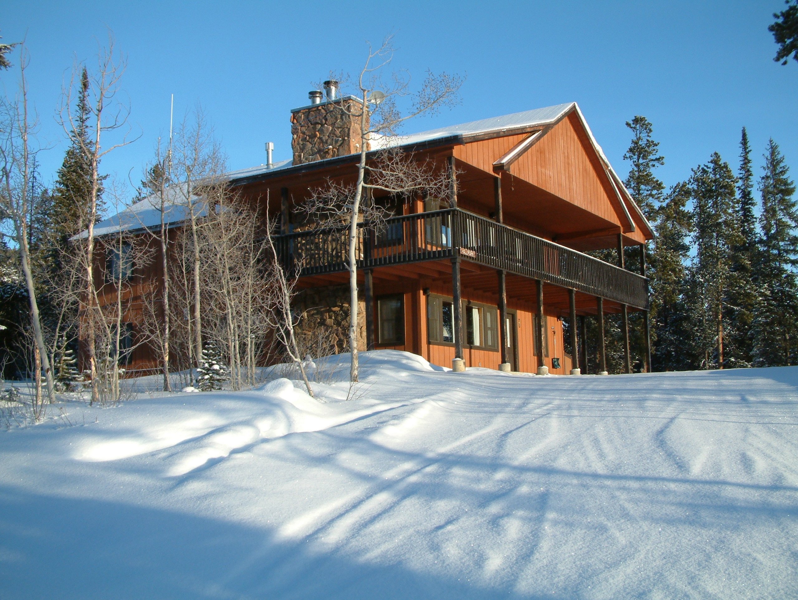 A 5 bedroom cabin surrounded by snowy woods